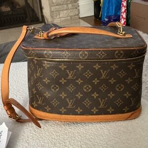 Sold . ........ Louis Vuitton Monogram vanity Bag with Tan Accents